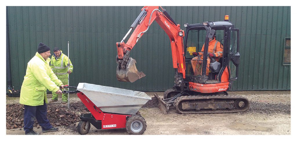 MUV Electric Wheelbarrow being loaded by mini digger