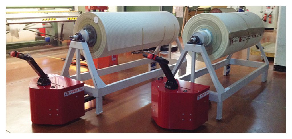 PowerTugs moving 3,500Kg fabric roll trolleys